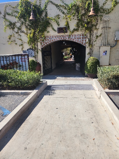 The tunnel like entry way that leads to Dripp Coffee in Fullerton